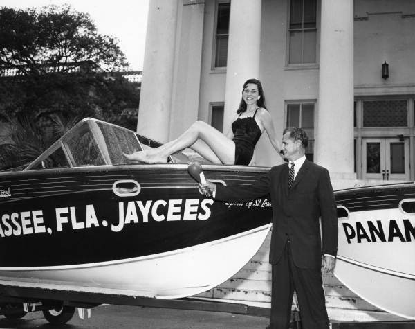 U.S. Senator George A. Smathers christening the “Spirit of St. Louis” in front of the State Capitol in Tallahassee.